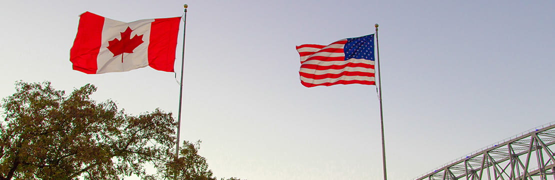 American and Canadian flags